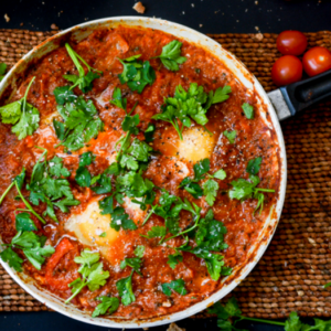 A one‑pan tomato and egg dish with light spices, suited to quick, simple meals.