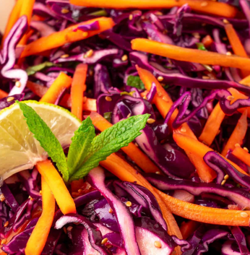 A simple raw cabbage and carrot salad with a light dressing, suited to quick preparation and everyday meals.