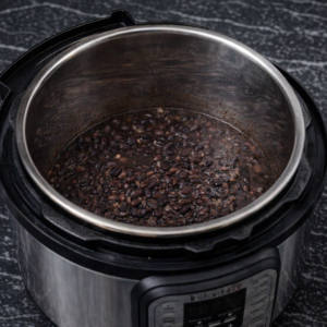 Soft, lightly spiced black beans with enough liquid to keep them versatile for everyday use.