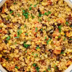 A one‑pan quinoa dish cooked with vegetables, beans, and mild spices, designed for quick weeknight meals with minimal washing up.